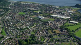 5.5K aerial stock footage approach and tilt to residential neighborhood, Dumbarton, Scotland Aerial Stock Footage | AX110_138E