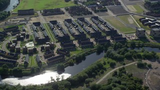 5.5K aerial stock footage of riverfront row houses along River Clyde, Glasgow, Scotland Aerial Stock Footage | AX110_189