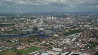 5.5K aerial stock footage approach River Clyde, arena and concert hall, Glasgow, Scotland Aerial Stock Footage | AX110_202E