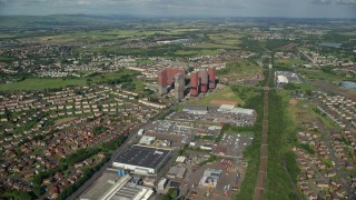 AX110_215E - 5.5K aerial stock footage approach tall apartment buildings, Glasgow, Scotland