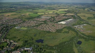 5.5K aerial stock footage of a roundabout and residential neighborhood, Glasgow, Scotland Aerial Stock Footage | AX110_217E