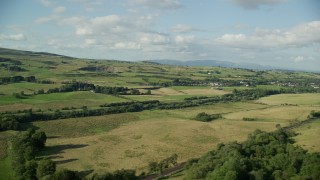 5.5K aerial stock footage of green farm fields in a rural landscape, Bonnybridge, Scotland Aerial Stock Footage | AX111_001