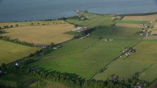 AX111_028E - 5.5K aerial stock footage fly over historic Blackness Castle beside the Firth of Forth, Scotland