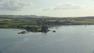 AX111_033E - 5.5K aerial stock footage approach historic Blackness Castle from River Forth, Scotland