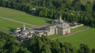 AX111_048E - 5.5K aerial stock footage of passing Hopetoun House in Scotland