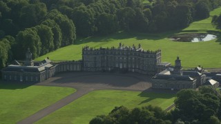 AX111_051 - 5.5K aerial stock footage of passing by Hopetoun House in Scotland