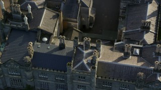 AX111_091 - 5.5K aerial stock footage fly over Dalmeny House and tilt to courtyard, Edinburgh, Scotland