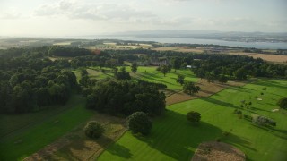 AX111_096E - 5.5K aerial stock footage fly over Dundas Castle in South Queensferry, Scotland