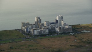 5.5K aerial stock footage of apartment buildings by the water, Edinburgh, Scotland Aerial Stock Footage | AX111_116