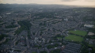 5.5K aerial stock footage approach and fly over row houses in Edinburgh, Scotland Aerial Stock Footage | AX111_162