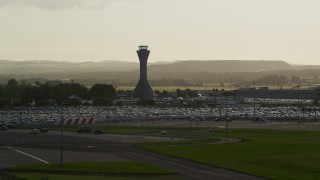 5.5K aerial stock footage of the control tower at Edinburgh Airport, Scotland Aerial Stock Footage | AX111_170