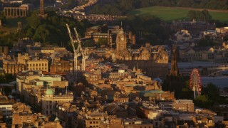 5.5K aerial stock footage video of Balmoral Hotel and Scott Monument in Edinburgh, Scotland at sunset Aerial Stock Footage | AX112_031E