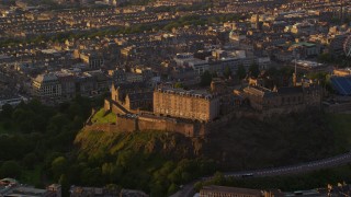 5.5K aerial stock footage video of orbiting Edinburgh Castle, Scotland at sunset Aerial Stock Footage | AX112_051