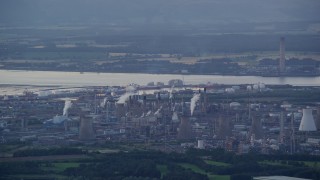 5.5K aerial stock footage of a natural gas plant overlooking the water, Falkirk, Scotland at twilight Aerial Stock Footage | AX112_142E