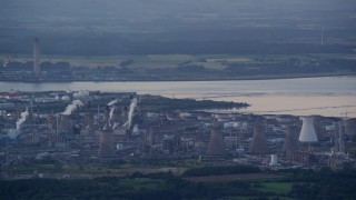 5.5K aerial stock footage flyby natural gas plant by the water, Falkirk, Scotland at twilight Aerial Stock Footage | AX112_144E