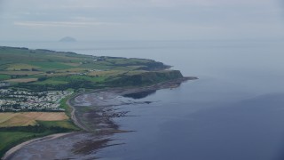 5.5K aerial stock footage approach coastal cliffs on Firth of Clyde, Ayr, Scotland Aerial Stock Footage | AX113_042