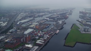 5.5K aerial stock footage flyby Port of Belfast toward M2 Freeway, Northern Ireland Aerial Stock Footage | AX113_107E