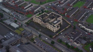 5.5K aerial stock footage of orbiting an abandoned courthouse, Belfast, Northern Ireland Aerial Stock Footage | AX113_111