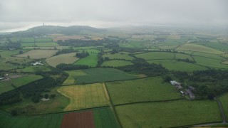 5.5K aerial stock footage of farms and farm fields on the way to Scrabo Tower, Newtownards, Northern Ireland Aerial Stock Footage | AX113_132