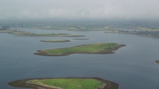 5.5K aerial stock footage flyby islands in a sea loch, Strangford Lough, Northern Ireland Aerial Stock Footage | AX113_142E