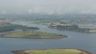 5.5K aerial stock footage of passing islands and a harbor in Strangford Lough, Northern Ireland Aerial Stock Footage | AX113_145E