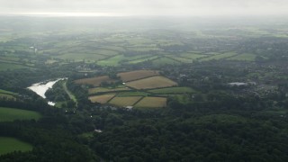 5.5K aerial stock footage of farm fields and trees around the Quoile River, Downpatrick, Northern Ireland Aerial Stock Footage | AX113_164E