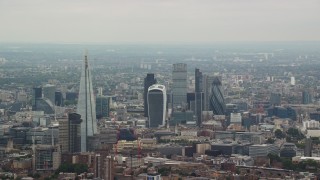 5.5K aerial stock footage approach The Shard Central and skyscrapers in Central London, England Aerial Stock Footage | AX114_019