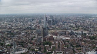 AX114_021E - 5.5K aerial stock footage of flying by The Shard skyscraper for view of Tower Bridge, London, England