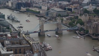 5.5K aerial stock footage of Tower Bridge over River Thames near Tower of London, Central London, England Aerial Stock Footage | AX114_055