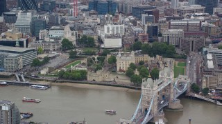 AX114_096E - 5.5K aerial stock footage of iconic Tower of London overlooking the River Thames, England