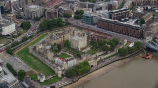 5.5K aerial stock footage tilt to bird's eye of tourists at the Tower of London, England Aerial Stock Footage | AX114_101E