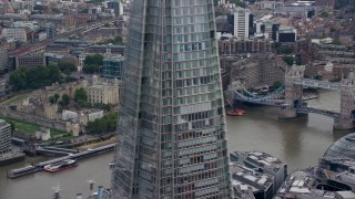 5.5K aerial stock footage of Tower of London and Tower Bridge on the River Thames, England, reveal The Shard Aerial Stock Footage | AX114_118