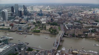 5.5K aerial stock footage wide view of Tower Bridge near Tower of London and Central London skyscrapers, England Aerial Stock Footage | AX114_122E