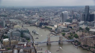 5.5K aerial stock footage of flying away from Tower Bridge and River Thames, England Aerial Stock Footage | AX114_125