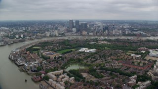 5.5K aerial stock footage of Canary Wharf skyscrapers on the opposite side of the River Thames, London, England Aerial Stock Footage | AX114_126E