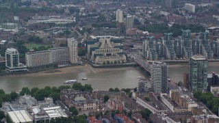 5.5K aerial stock footage of MI6 Building, and Vauxhall Bridge over River Thames, London, England Aerial Stock Footage | AX114_173E