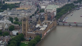 5.5K aerial stock footage of Big Ben, Parliament and Westminster Abbey across River Thames, London, England Aerial Stock Footage | AX114_177E