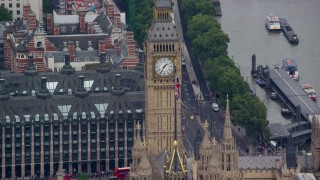 5.5K aerial stock footage flyby Big Ben and the British flag, London, England Aerial Stock Footage | AX114_225