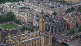 5.5K aerial stock footage orbit Big Ben, Bridge Street and Portcullis House, London, England Aerial Stock Footage | AX114_228E