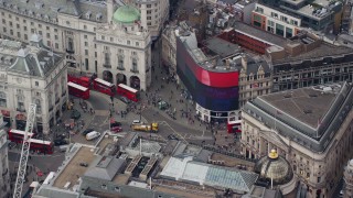 5.5K aerial stock footage of an orbit around buses and traffic at Piccadilly Circus, London, England Aerial Stock Footage | AX114_241