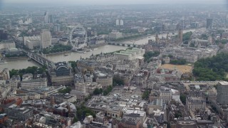 5.5K aerial stock footage of London Eye and bridges spanning the River Thames, London, England Aerial Stock Footage | AX114_244