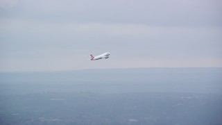 5.5K aerial stock footage tracking commercial jet while ascending from Heathrow Airport, England Aerial Stock Footage | AX114_292