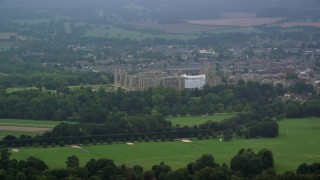 5.5K aerial stock footage of Windsor Castle surrounded by green trees, England Aerial Stock Footage | AX114_302