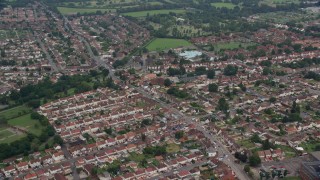 5.5K aerial stock footage of orbiting a residential neighborhood and fly away, Slough, England Aerial Stock Footage | AX114_320E