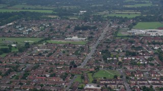 5.5K aerial stock footage of orbiting row houses in a residential neighborhood, Slough, England Aerial Stock Footage | AX114_322E