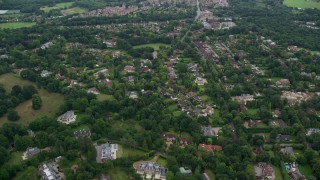 5.5K aerial stock footage fly over upscale homes and trees, Virginia Water, England Aerial Stock Footage | AX114_348