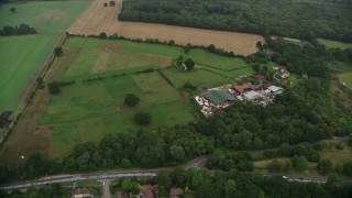 5.5K aerial stock footage fly over homes and farmland, Redhill, England Aerial Stock Footage | AX115_001E