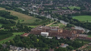 5.5K aerial stock footage of flying around Hampton Court Palace, Molesey, England Aerial Stock Footage | AX115_025