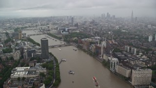 5.5K aerial stock footage of River Thames winding through the city while raining, London, England Aerial Stock Footage | AX115_083E