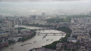 5.5K aerial stock footage video of Waterloo Bridge over the River Thames near London Eye, England Aerial Stock Footage | AX115_095